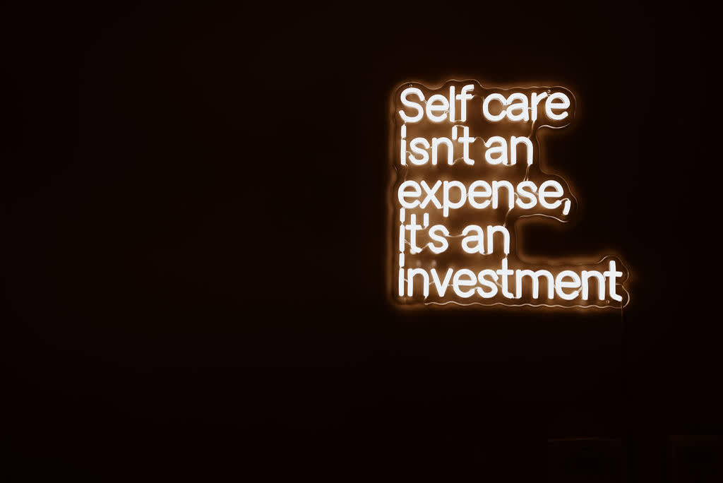 Wall sign glowing on a dark wall in the treatment room